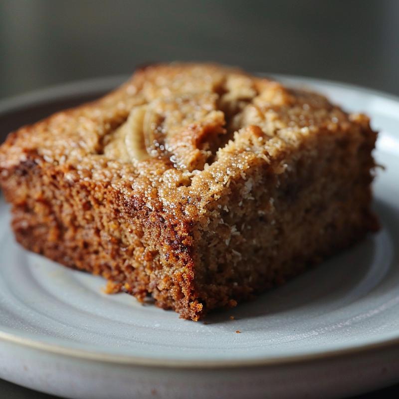 Close-up of gluten-free banana muffins on a light grey ceramic plate.